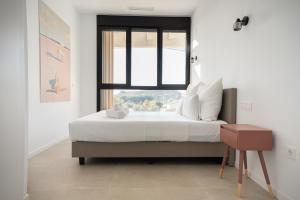 Pure Sea Apartments Villajoyosa客房内的一张或多张床位