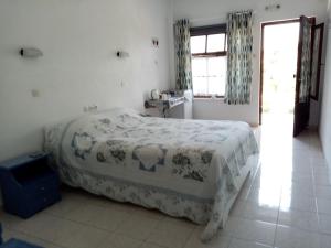 a bedroom with a large bed in a room at Dawn's Rooms in Patitiri +5 photos