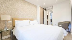 A bed or beds in a room at Vistas al mar - Primera línea playa de Malagueta