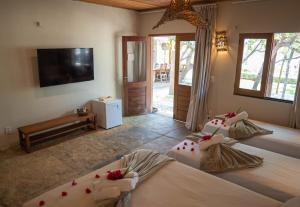 Vila Mani Atins Casa com Piscina客房内的一张或多张床位