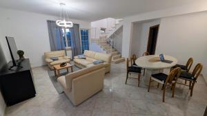 a living room with a couch and a table at Villa Fabiani in Fonte Nuova