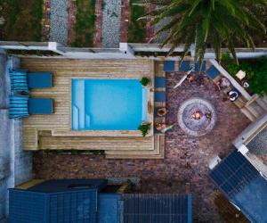 an overhead view of a swimming pool on a building at Ocean Call Inn in Plettenberg Bay