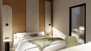 Alizo Comfort Chic Stay Rhodes - Adults Only tesisinde bir odada yatak veya yataklar