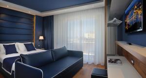 TV a/nebo společenská místnost v ubytování Hotel Concord