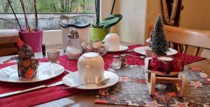 a dining room table with christmas decorations on it at Hotel Sudenburger Hof in Magdeburg