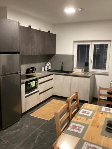 Kuchyň nebo kuchyňský kout v ubytování Apartmány Ořechovka Wellness