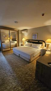 Ένα ή περισσότερα κρεβάτια σε δωμάτιο στο SEVER SUİTES HOTEL