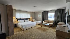 Ένα ή περισσότερα κρεβάτια σε δωμάτιο στο SEVER SUİTES HOTEL