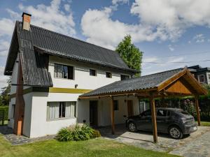a car parked in front of a house at Casa Vintage in San Carlos de Bariloche