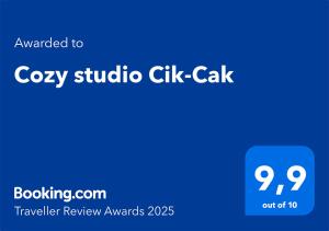 Sertifikat, penghargaan, tanda, atau dokumen yang dipajang di Cozy studio Cik-Cak