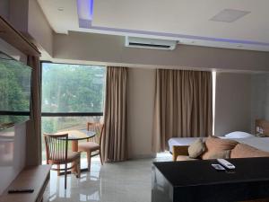 Postel nebo postele na pokoji v ubytování Flat confortável no Tropical executive hotel + 17 fotografií