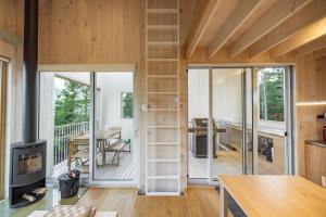 a house with a living room with a fireplace at Chalet BLOK in Lac-Beauport +12 photos
