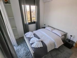 Postel nebo postele na pokoji v ubytování Villa Maximos