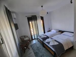 Postel nebo postele na pokoji v ubytování Villa Maximos