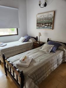 Ένα ή περισσότερα κρεβάτια σε δωμάτιο στο Rincón de Pita