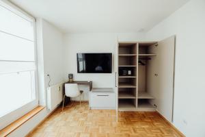 TV a/nebo společenská místnost v ubytování GH Luxury Apartments Graz, Gösser Haus