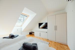 TV a/nebo společenská místnost v ubytování GH Luxury Apartments Graz, Gösser Haus