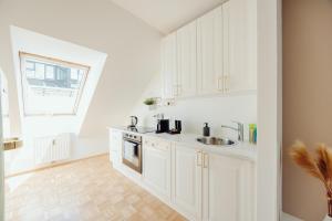 Kuchyň nebo kuchyňský kout v ubytování GH Luxury Apartments Graz, Gösser Haus