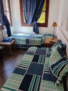 Ένα ή περισσότερα κρεβάτια σε δωμάτιο στο Chalet Las Nenas B&B