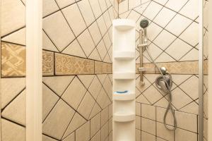 a bathroom with a shower and a toilet at Orientale 205 Baunei in Baunei +39 photos