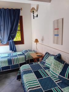 Ένα ή περισσότερα κρεβάτια σε δωμάτιο στο Chalet Las Nenas B&B