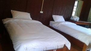 Cama o camas de una habitación en Syvongsack Lodge