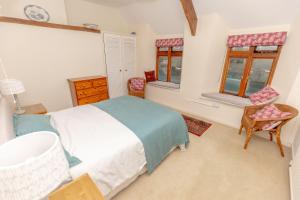 Voodi või voodid majutusasutuse Honeysuckle Cottage Newton Ferrers toas