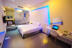 Postel nebo postele na pokoji v ubytování Galaxia Business Hotel