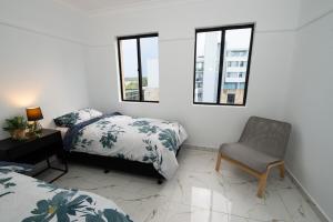 Ένα ή περισσότερα κρεβάτια σε δωμάτιο στο 2Bedrooms, 2-bath, 1 Garage Apartment