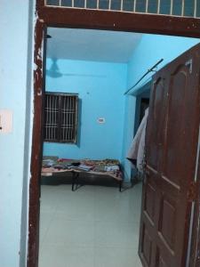 a room with a room with a bed and a door at Pathak,s home in Ayodhya