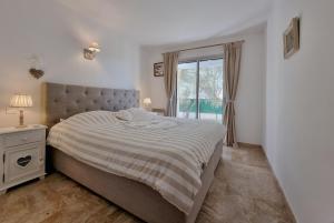 Ένα ή περισσότερα κρεβάτια σε δωμάτιο στο Jardin-duzes +28 φωτογραφίες