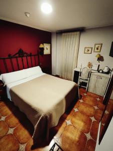 Postel nebo postele na pokoji v ubytování Hostal La Posada