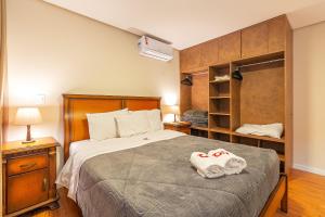Cama ou camas em um quarto em Morada do Sol 302 - Apto novo em Gramado