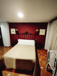 Postel nebo postele na pokoji v ubytování Hostal La Posada