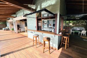 a bar on the deck of a house at Villa Acoma Lodge in Grand-Bourg