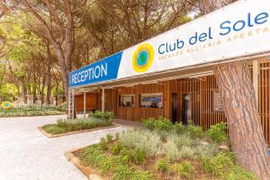 a building with a sign that reads club del sol at Club del Sole Viareggio Family Collection in Torre del Lago Puccini