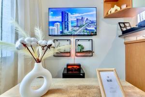TV a/nebo společenská místnost v ubytování Le Zen I T2