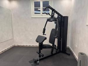 a room with a gym with a treadmill at Villa Clio, a Luxury Collection in Thessaloniki