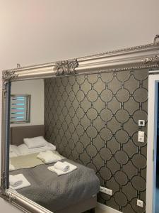 Posteľ alebo postele v izbe v ubytovaní Spa Residence Carbona Hévíz Apartments KAKADU 203 B