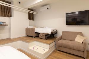 TV a/nebo společenská místnost v ubytování InscìBell Guest House
