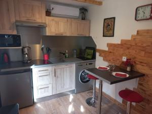 a kitchen with a sink and a dishwasher at La pampa in Cabannes