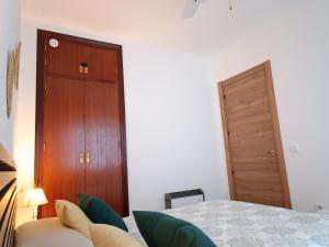 Un pat sau paturi într-o cameră la Apartamento Bellavista