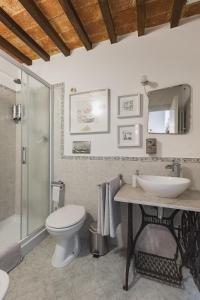 a bathroom with a toilet and a sink and a shower at Sofia a Montepulciano in Montepulciano +36 photos