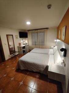 Postel nebo postele na pokoji v ubytování Hostal La Posada