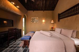 Кровать или кровати в номере Cháy Mountain Retreat Ninh Bình +55 фотографий