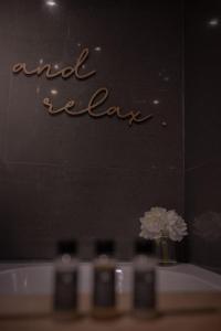 a vase of flowers on a table with the words endega at Central Llandeilo with Stunning views- Sleeps 2 in Llandeilo +24 photos
