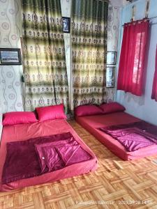 Postel nebo postele na pokoji v ubytování Blessed Homestay