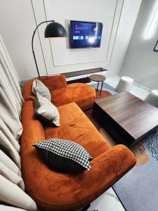 a living room with a couch and a table at Ihsuites in Asaba