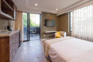 Voodi või voodid majutusasutuse El Tesoro Medellín Hab309 by Letoh toas