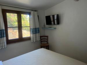 Postel nebo postele na pokoji v ubytování La PAVONCELLA 1